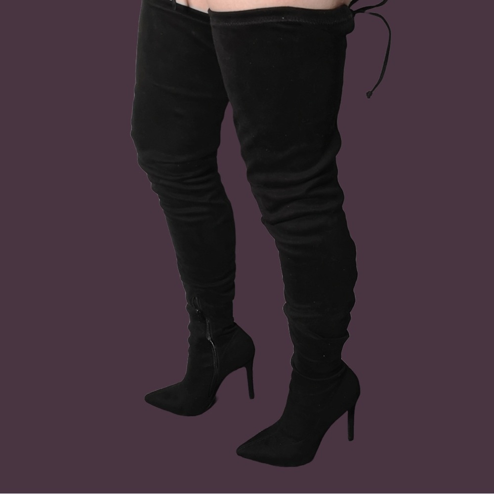 Black thigh-high heeled boots with back tie